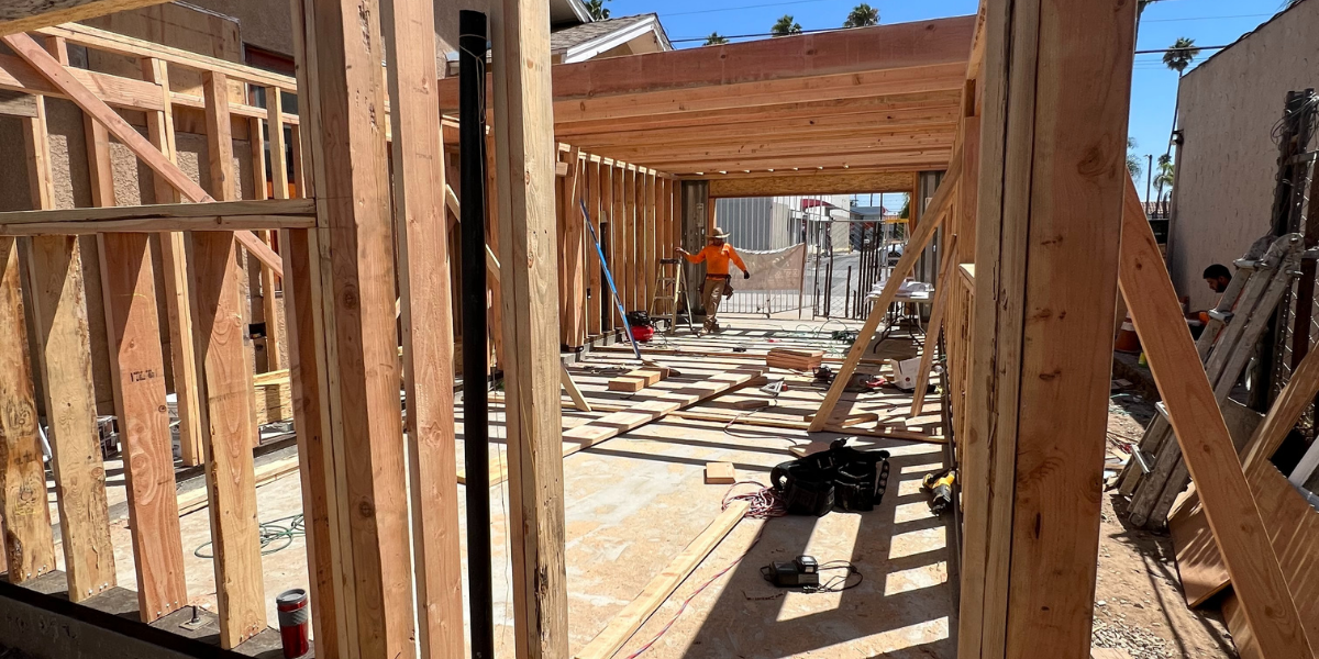 Framing of an accessory dwelling unit (ADU) under construction in Southern California showing wooden framework and early build stage.